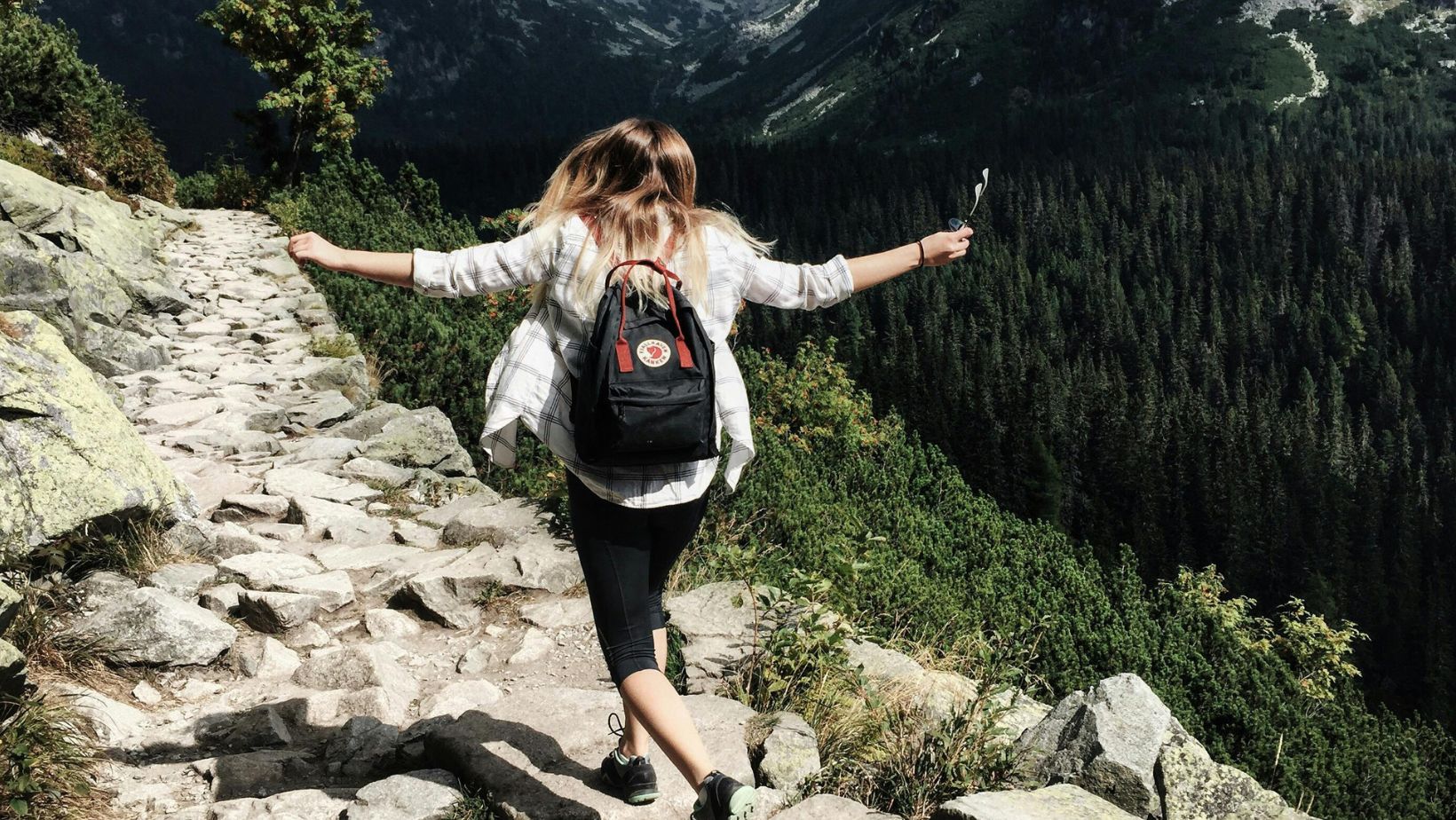 A woman hiking in the mountains