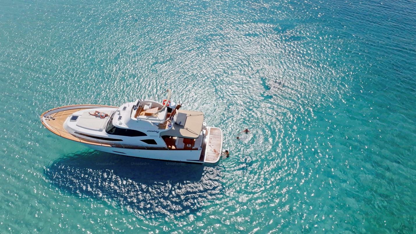 Aerial view of family swimming and sunbathing in Adriatic Sea during vacation.